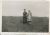 Dale and Sadie Edminster stand on a hill in a field.